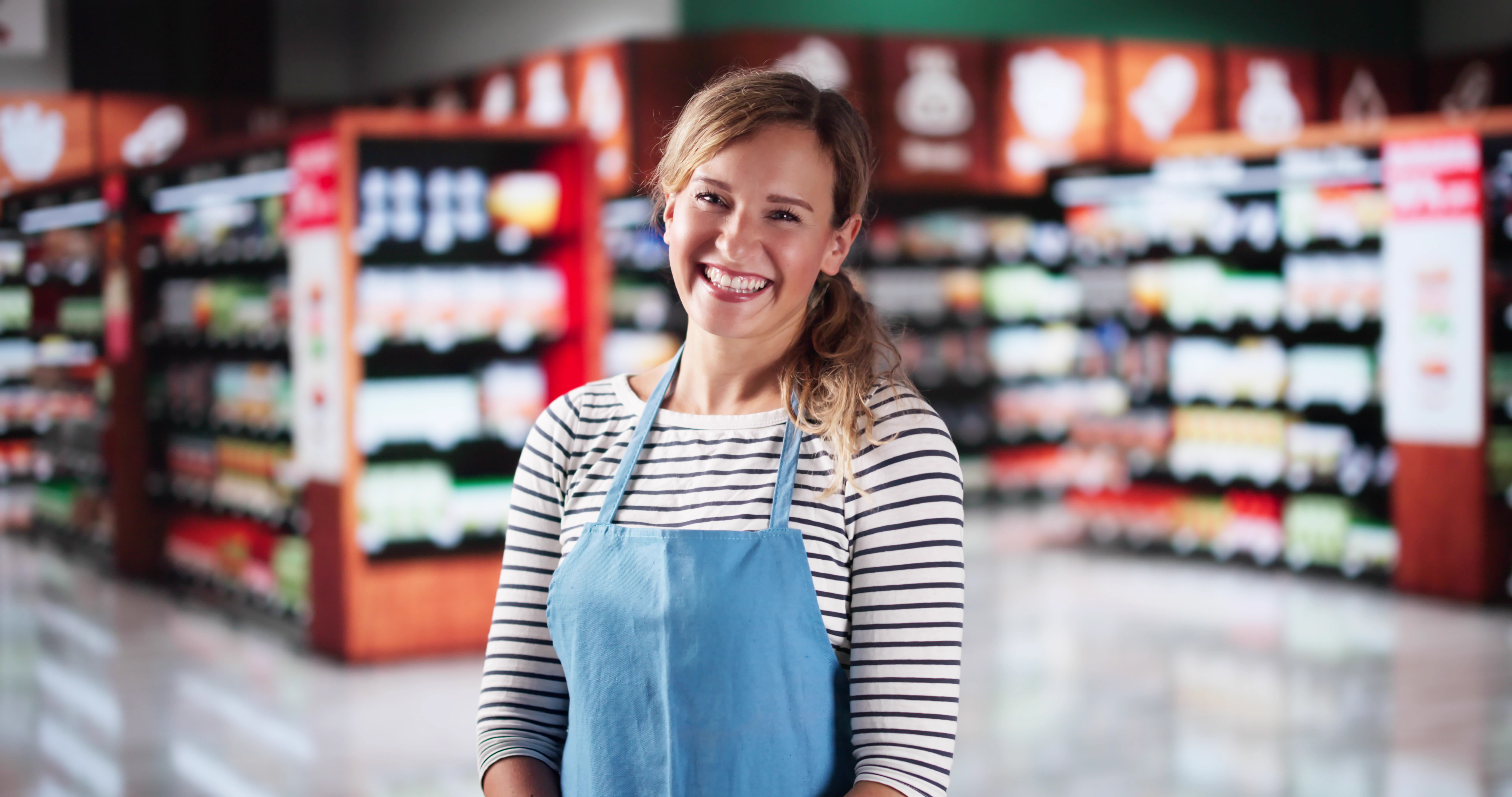 Retail Employee in front of shelving